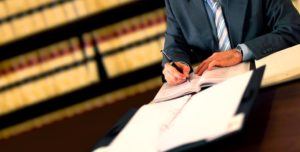 Image of a lawyer going over his notes on expungement at The Law Offices of Lawrence J. Signore in Providence, RI
